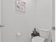 Small half bathroom with toilet and pedestal sink at 17019 Avon Dive Ln, Wimauma, FL 33598