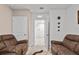 Comfortable sitting area with two armchairs at 17019 Avon Dive Ln, Wimauma, FL 33598