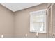Cozy bedroom with a window, sheer curtains, and closet at 19029 Us Highway 19 N # 26-304, Clearwater, FL 33764