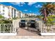 Community grilling station with two grills and seating area by the water at 19029 Us Highway 19 N # 26-304, Clearwater, FL 33764
