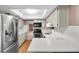 Bright kitchen featuring stainless steel appliances and white countertops at 19029 Us Highway 19 N # 26-304, Clearwater, FL 33764