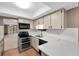 Updated kitchen, stainless steel appliances, and white countertops at 19029 Us Highway 19 N # 26-304, Clearwater, FL 33764