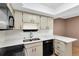 Modern kitchen with stainless steel appliances and white countertops at 19029 Us Highway 19 N # 26-304, Clearwater, FL 33764
