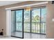 Living room featuring sliding glass doors to balcony at 19029 Us Highway 19 N # 26-304, Clearwater, FL 33764