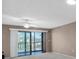 Bright living room with access to a private balcony at 19029 Us Highway 19 N # 26-304, Clearwater, FL 33764