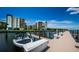 Private boat dock with a boat and storage space at 19531 Gulf Blvd # 205, Indian Shores, FL 33785