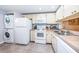 White appliances and good counter space in this efficient kitchen at 19531 Gulf Blvd # 205, Indian Shores, FL 33785