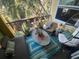 Relaxing balcony with outdoor furniture and potted plants at 2010 E Palm Ave # 15305, Tampa, FL 33605