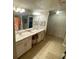 Double vanity bathroom with a large mirror and plenty of counter space at 2010 E Palm Ave # 15305, Tampa, FL 33605