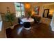 Small dining area with round table and four chairs, near a window at 2010 E Palm Ave # 15305, Tampa, FL 33605