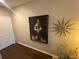 Bright entryway with hardwood floors, large art, and clock at 2010 E Palm Ave # 15305, Tampa, FL 33605