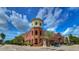 Brick building with Metro Market on the ground floor and apartments above at 2010 E Palm Ave # 15305, Tampa, FL 33605