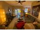 Spacious living area featuring a sectional sofa and access to a balcony at 2010 E Palm Ave # 15305, Tampa, FL 33605