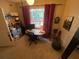 Home office with a desk, chair, and window with red curtains at 2010 E Palm Ave # 15305, Tampa, FL 33605