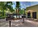 Community pool area with grill and patio furniture at 2010 E Palm Ave # 15305, Tampa, FL 33605