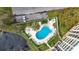 An aerial view showcasing a community pool with surrounding landscaping at 225 Country Club Dr # 1611, Largo, FL 33771