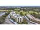 Aerial view of condo building with golf course and lush landscape at 225 Country Club Dr # 1611, Largo, FL 33771
