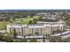 Aerial view of condo building showcasing its exterior and landscaping at 225 Country Club Dr # 1611, Largo, FL 33771