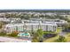 An aerial view of the condo building with a pool and waterfront access at 225 Country Club Dr # 1611, Largo, FL 33771