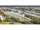 Aerial view of condo building near water, showcasing its size and location at 225 Country Club Dr # 1611, Largo, FL 33771