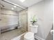 Large walk-in shower with bench seating and modern fixtures at 225 Country Club Dr # 1611, Largo, FL 33771