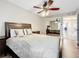 Bright bedroom with a queen-size bed and mirrored closet doors at 225 Country Club Dr # 1611, Largo, FL 33771