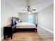 Large bedroom with king-size bed and window at 225 Country Club Dr # 1611, Largo, FL 33771