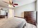 Bedroom with queen bed, dresser, and ceiling fan at 225 Country Club Dr # 1611, Largo, FL 33771