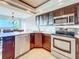 Stylish kitchen with stainless steel appliances and granite countertop at 225 Country Club Dr # 1611, Largo, FL 33771