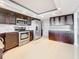 Modern kitchen with stainless steel appliances and granite countertops at 225 Country Club Dr # 1611, Largo, FL 33771