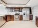Modern kitchen with stainless steel appliances and granite countertops at 225 Country Club Dr # 1611, Largo, FL 33771