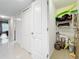 Laundry room with washer, dryer, and shelving at 225 Country Club Dr # 1611, Largo, FL 33771