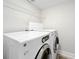 Clean laundry room with GE washer and dryer at 225 Country Club Dr # 1611, Largo, FL 33771