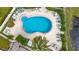 Relaxing community pool with surrounding patio and lush landscaping at 225 Country Club Dr # 1611, Largo, FL 33771