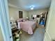 Spacious bedroom with a queen-size bed and ensuite bath at 2461 Rhodesian Dr # 51, Clearwater, FL 33763