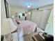 Bright bedroom with queen bed and ample closet space at 2461 Rhodesian Dr # 51, Clearwater, FL 33763