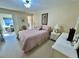Light and airy bedroom with queen bed and adjacent bath at 2461 Rhodesian Dr # 51, Clearwater, FL 33763