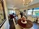 Dining room with table and chairs, view of living room at 2461 Rhodesian Dr # 51, Clearwater, FL 33763