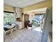 Kitchen with white cabinets and breakfast nook at 2461 Rhodesian Dr # 51, Clearwater, FL 33763