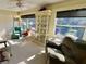 Sunroom boasts ample natural light and comfortable seating at 2461 Rhodesian Dr # 51, Clearwater, FL 33763