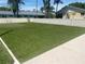 Artificial turf backyard with a putting green, perfect for outdoor recreation at 2465 Northside Dr # 1203, Clearwater, FL 33761