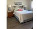 Cozy bedroom with a white bed and light blue accents at 2465 Northside Dr # 1203, Clearwater, FL 33761