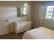Bedroom with a white dresser and a double bed, featuring plenty of natural light at 2465 Northside Dr # 1203, Clearwater, FL 33761