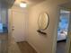 Bright condo entry with mirror, floating shelf and view of bedroom at 2465 Northside Dr # 1203, Clearwater, FL 33761