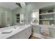 Spa-like bathroom with double vanity and shelves at 2850 Deer Run, Tarpon Springs, FL 34688