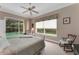 Comfortable bedroom with a view of the pool from the bed at 2850 Deer Run, Tarpon Springs, FL 34688