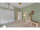 Spacious bedroom with double doors and carpet at 2850 Deer Run, Tarpon Springs, FL 34688