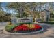Grey Oaks community entrance with stone pillars, signage, and lush landscaping at 2850 Deer Run, Tarpon Springs, FL 34688