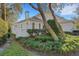 Home exterior showcasing landscaping and architecture at 2850 Deer Run, Tarpon Springs, FL 34688
