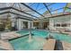 Relaxing screened pool and spa with fountain at 2850 Deer Run, Tarpon Springs, FL 34688